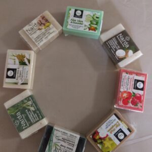 A circle of different types of soap bars.