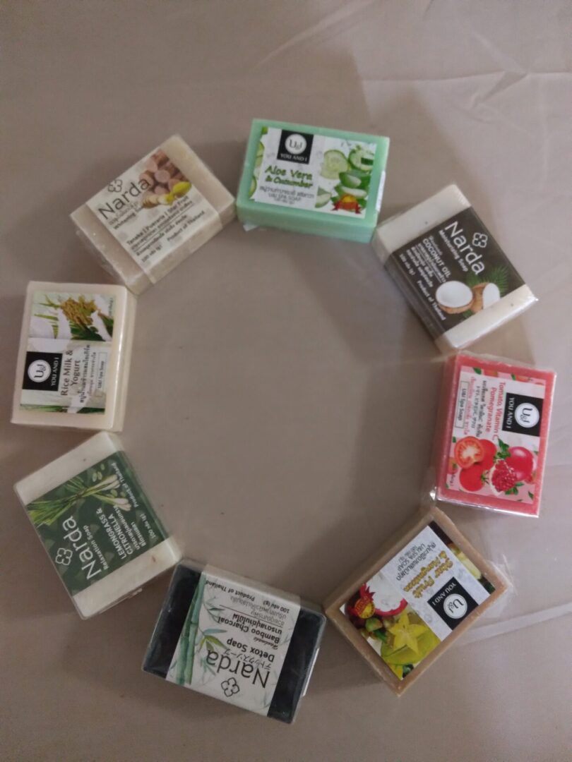 A circle of different types of soap bars.